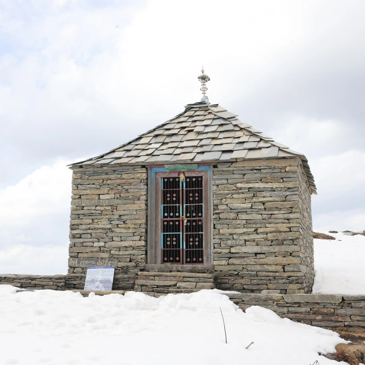 The stone hut on the summit meadow of Raghupur Fort under snow