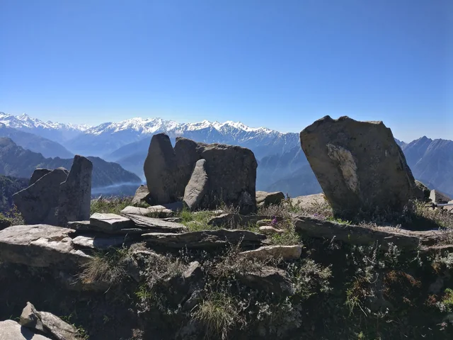 Standing stones on the Chandrakhani pass, snow peaks beyond