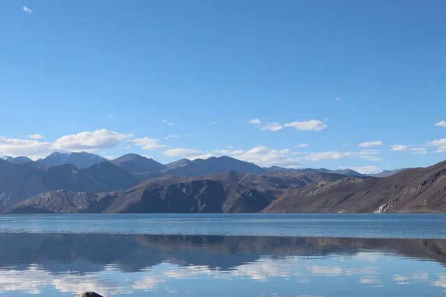 Still water and brown mountains at Pangong Tso