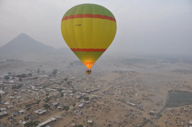 A hot air balloon over a valley