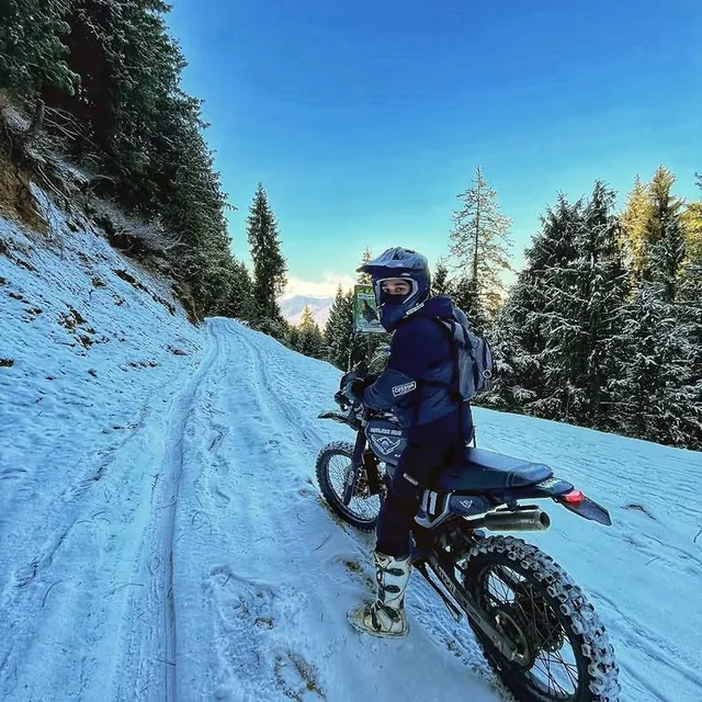 A dirt bike on a snowy trail