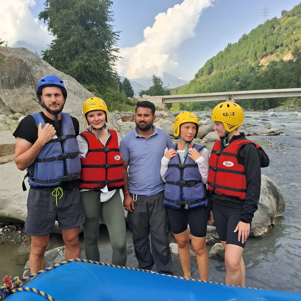 Guests and their guide beside the raft