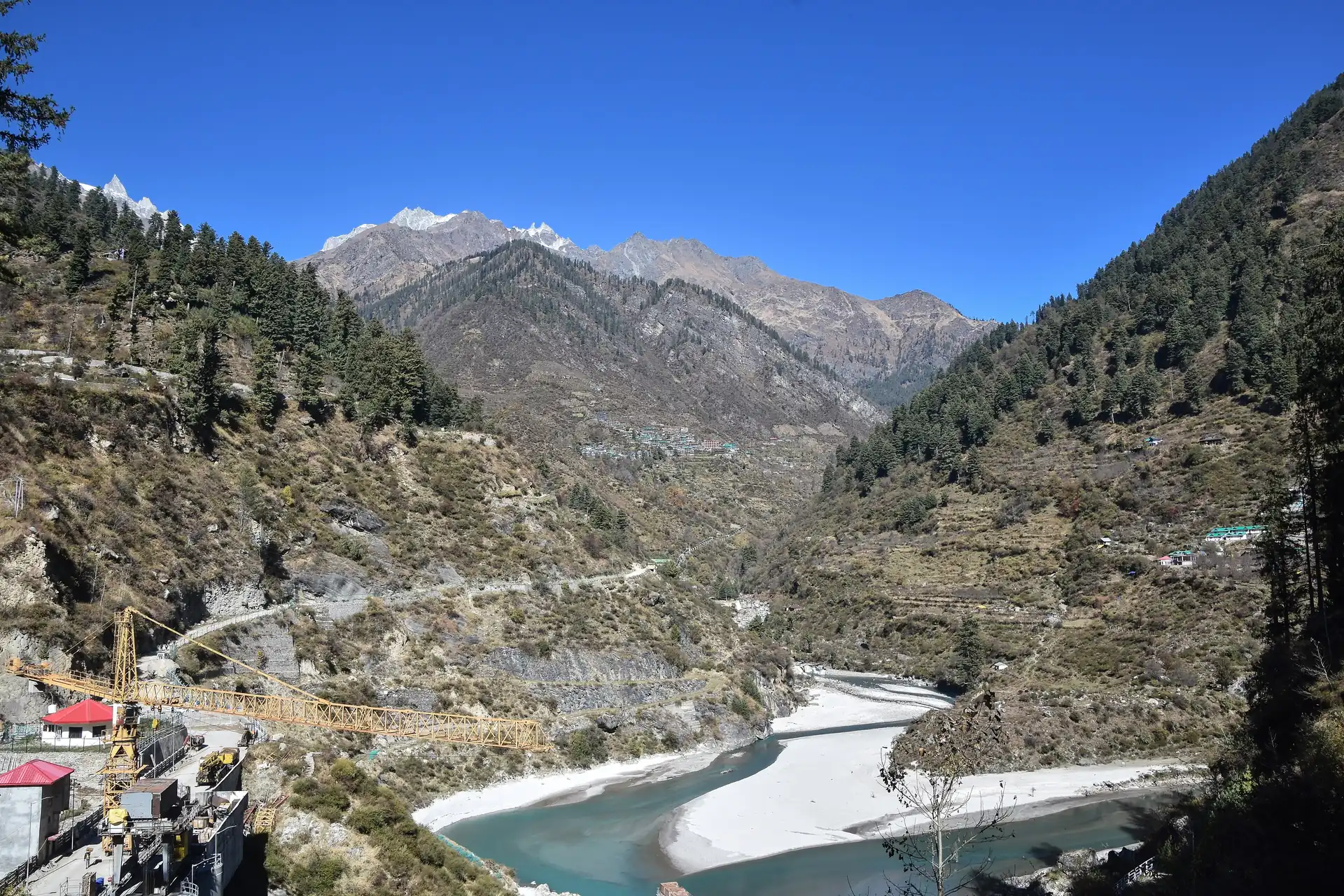 Tosh in the distance above the Parvati and the dam pond at Pulga