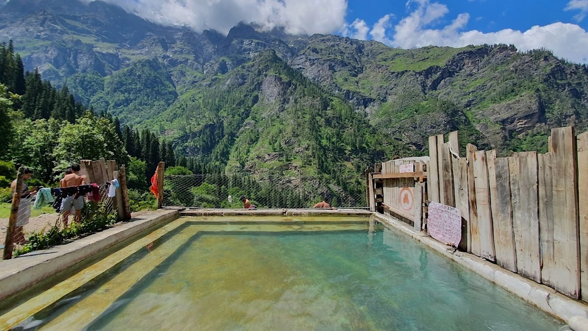 The hot-spring pool at Kheerganga with the valley behind