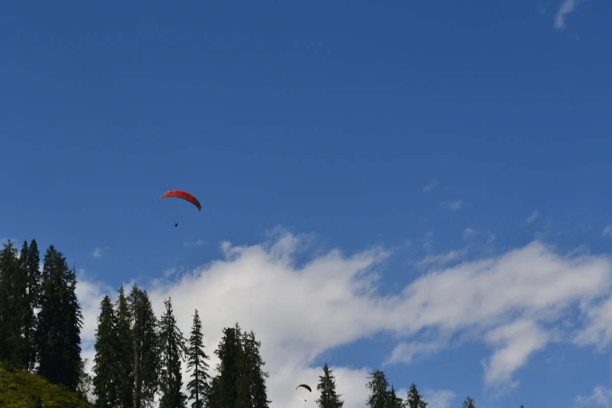 Two paragliders over Solang against the ridge