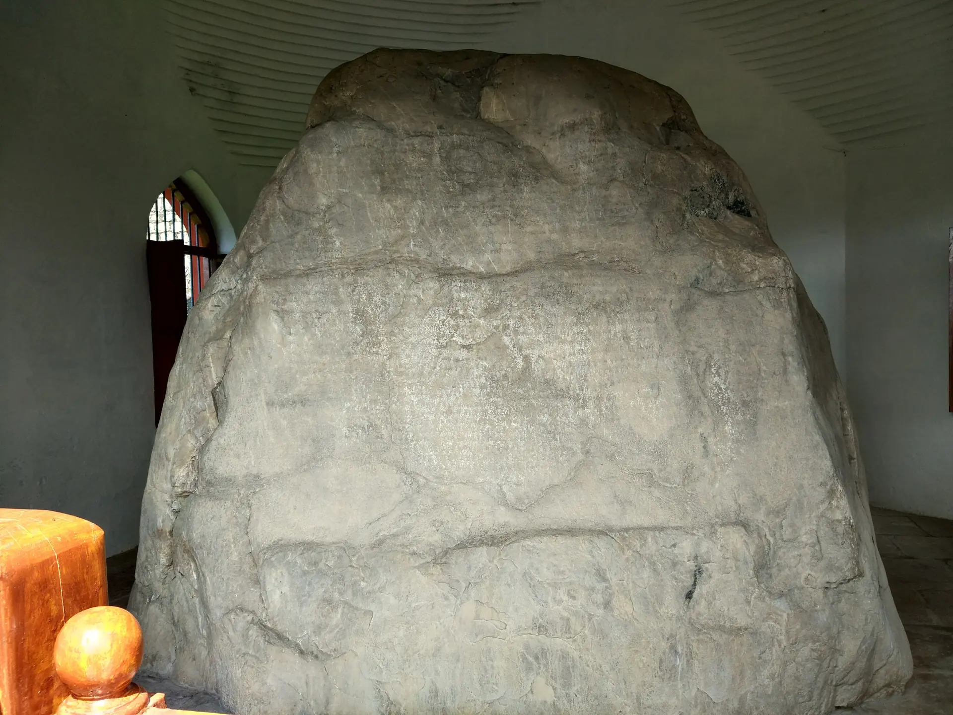 The Rock Edicts of Kalsi: a large pale boulder with Ashoka's inscriptions faintly visible on its face