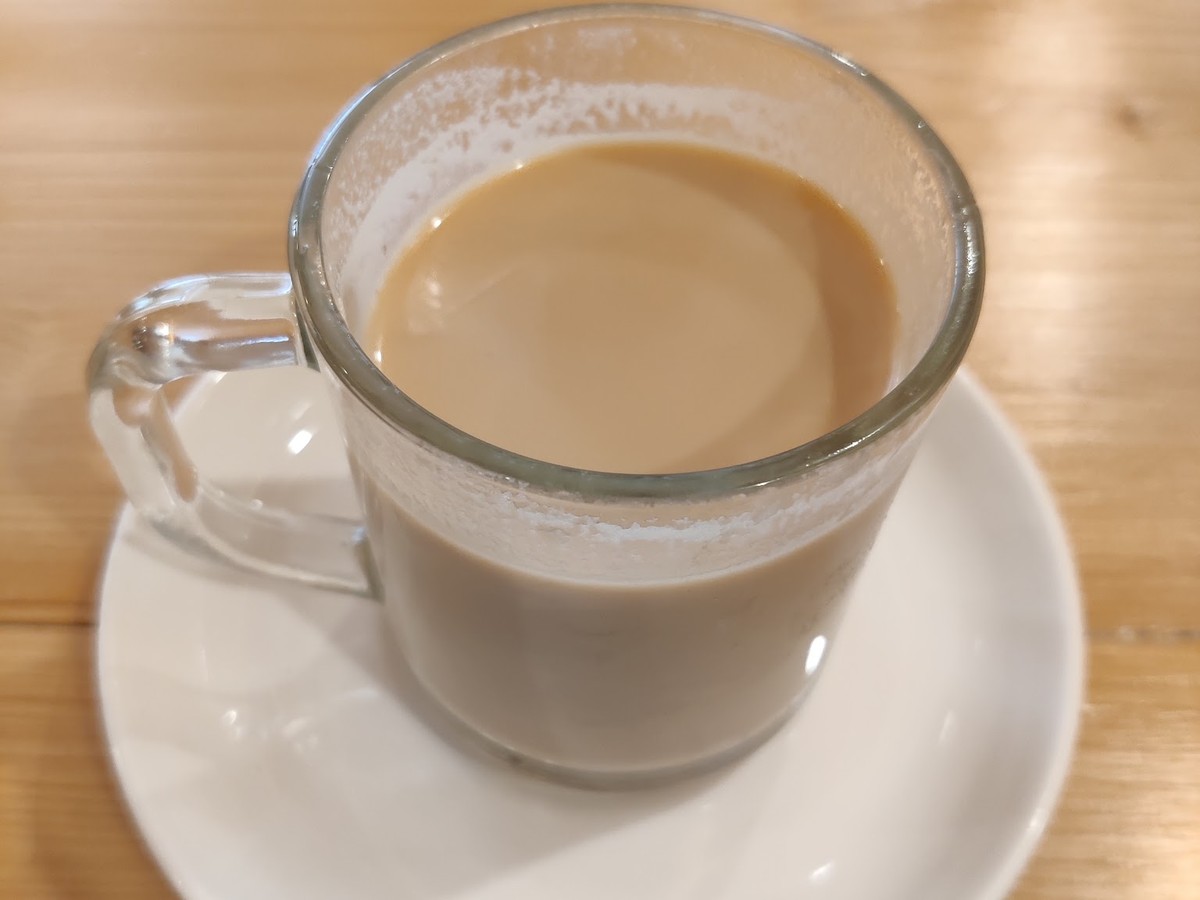 Milk coffee in a glass mug