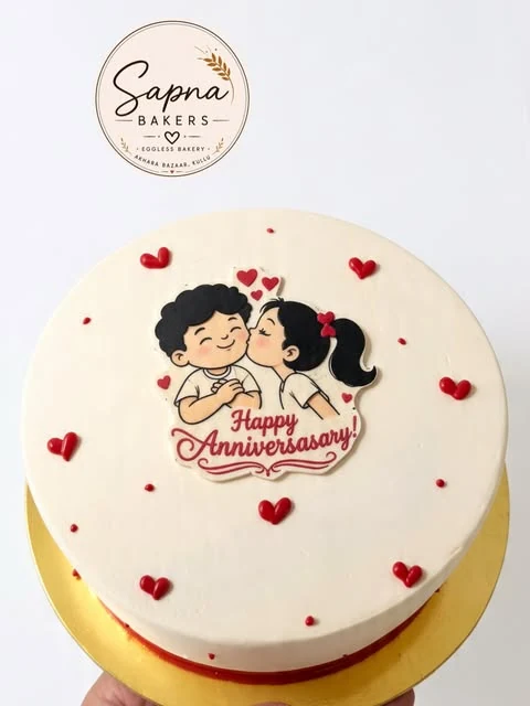 A white anniversary cake with a hand-drawn couple