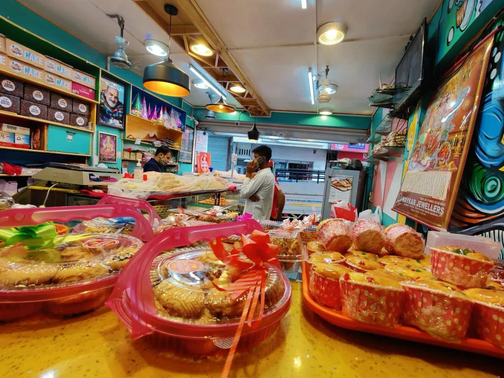 Shelves of biscuits, dry cakes and namkeen inside the shop