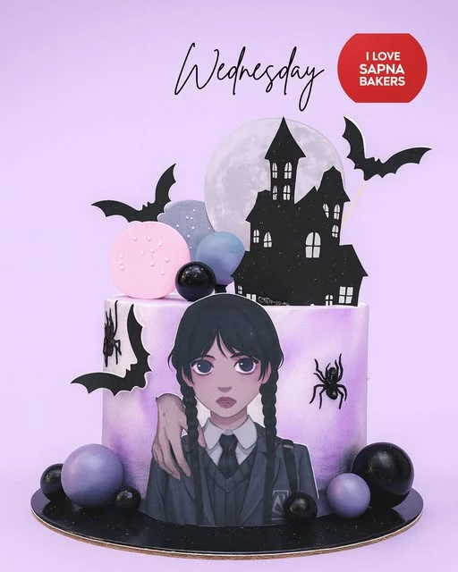 A purple Wednesday-theme cake with bats