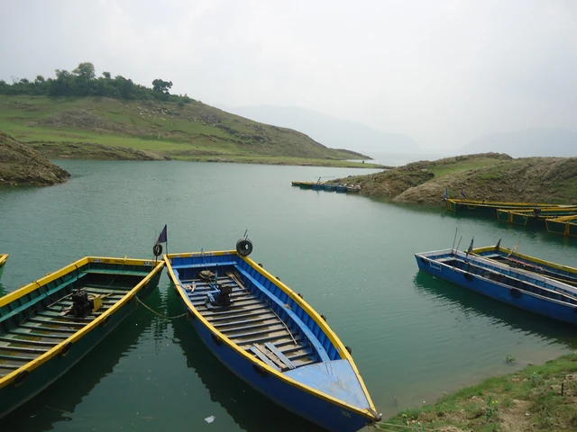 The reservoir stretching away between folded hills