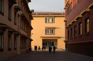 A lane between monastery buildings in the Bir Tibetan Colony
