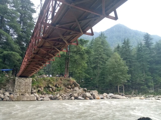 The Kasol footbridge seen from the riverbank below