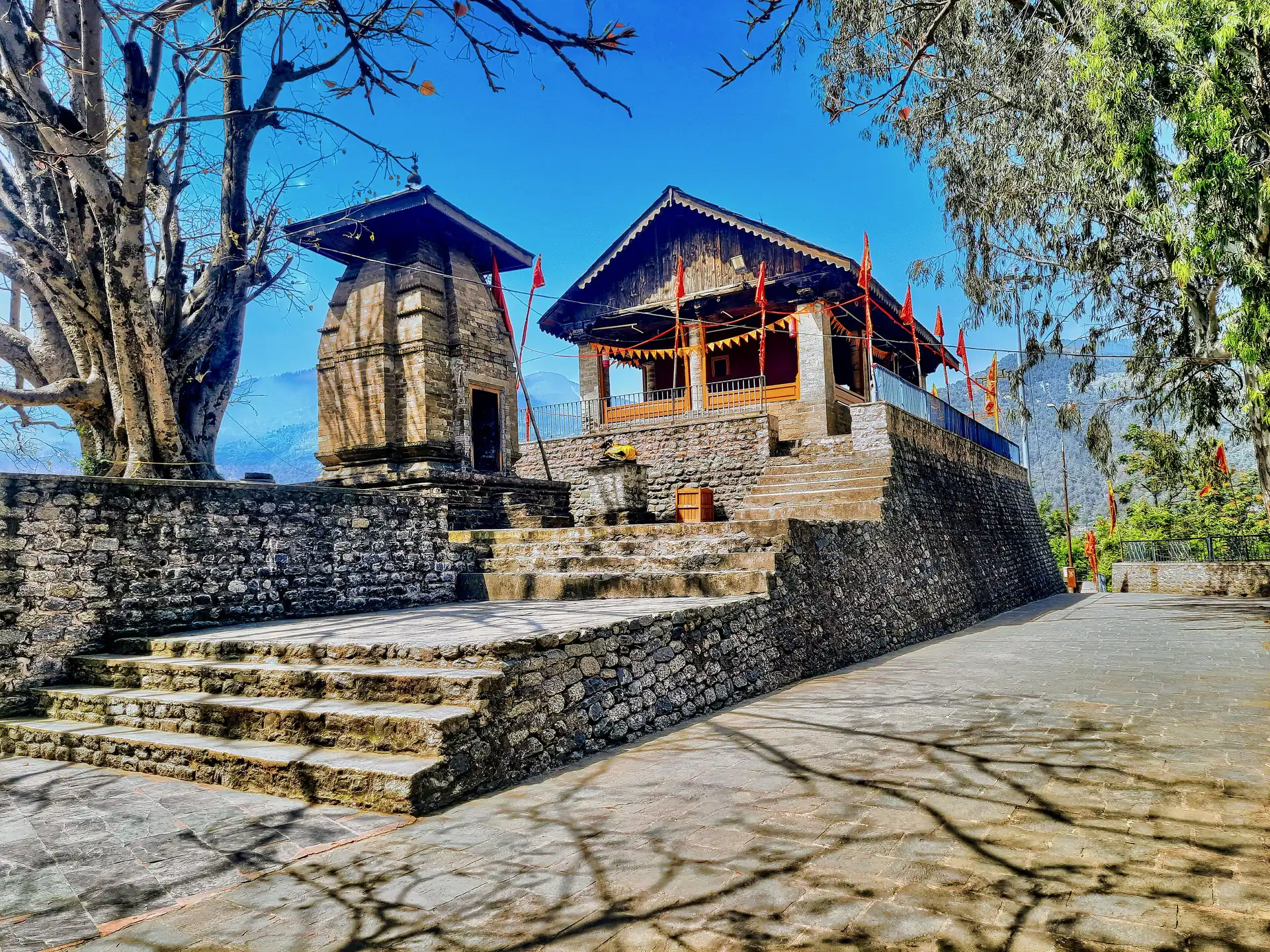 The wooden gabled Chamunda Devi Temple above Chamba
