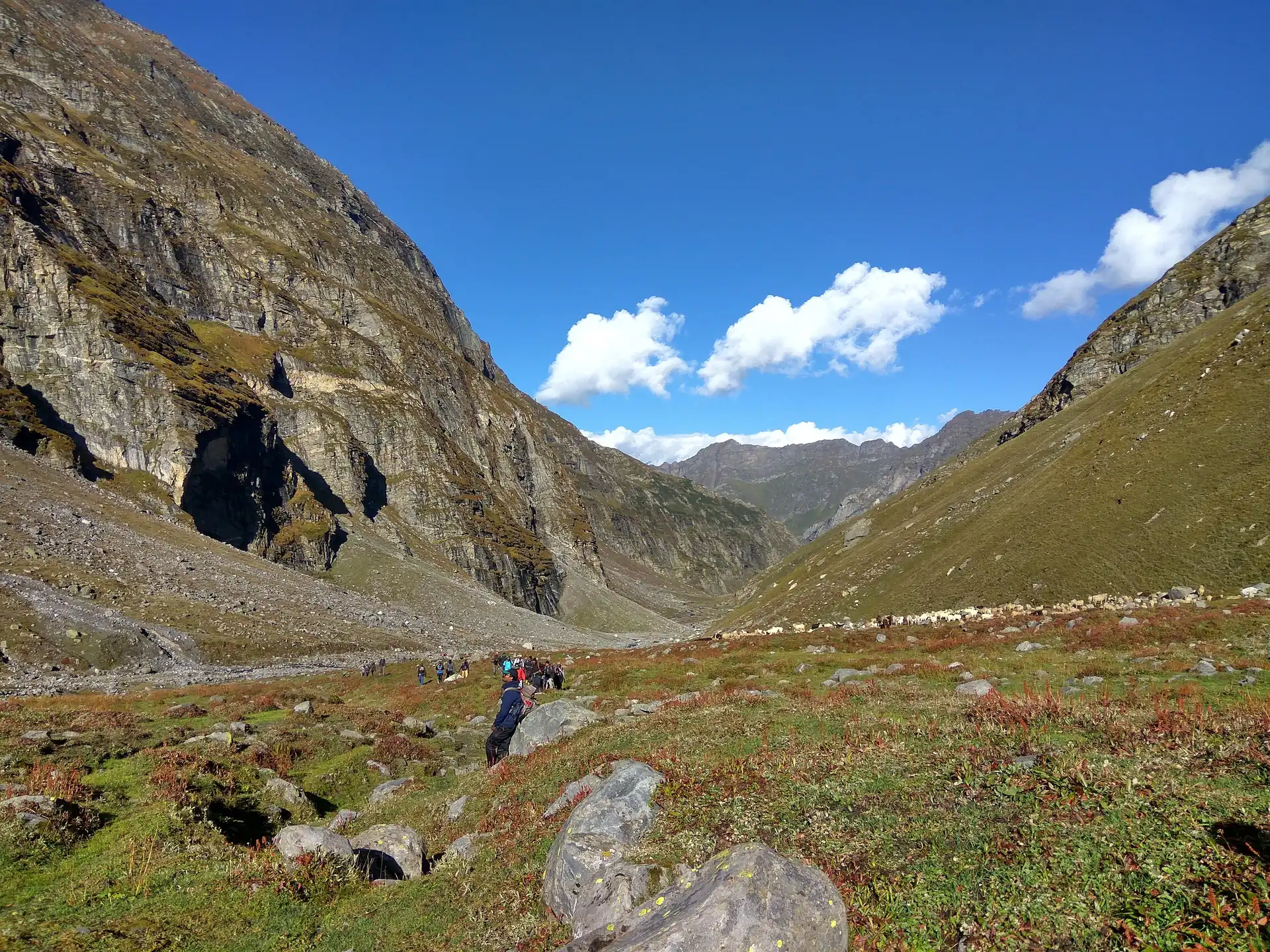 A walker in the Hampta valley below the pass