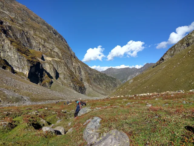 A walker in the Hampta valley below the pass