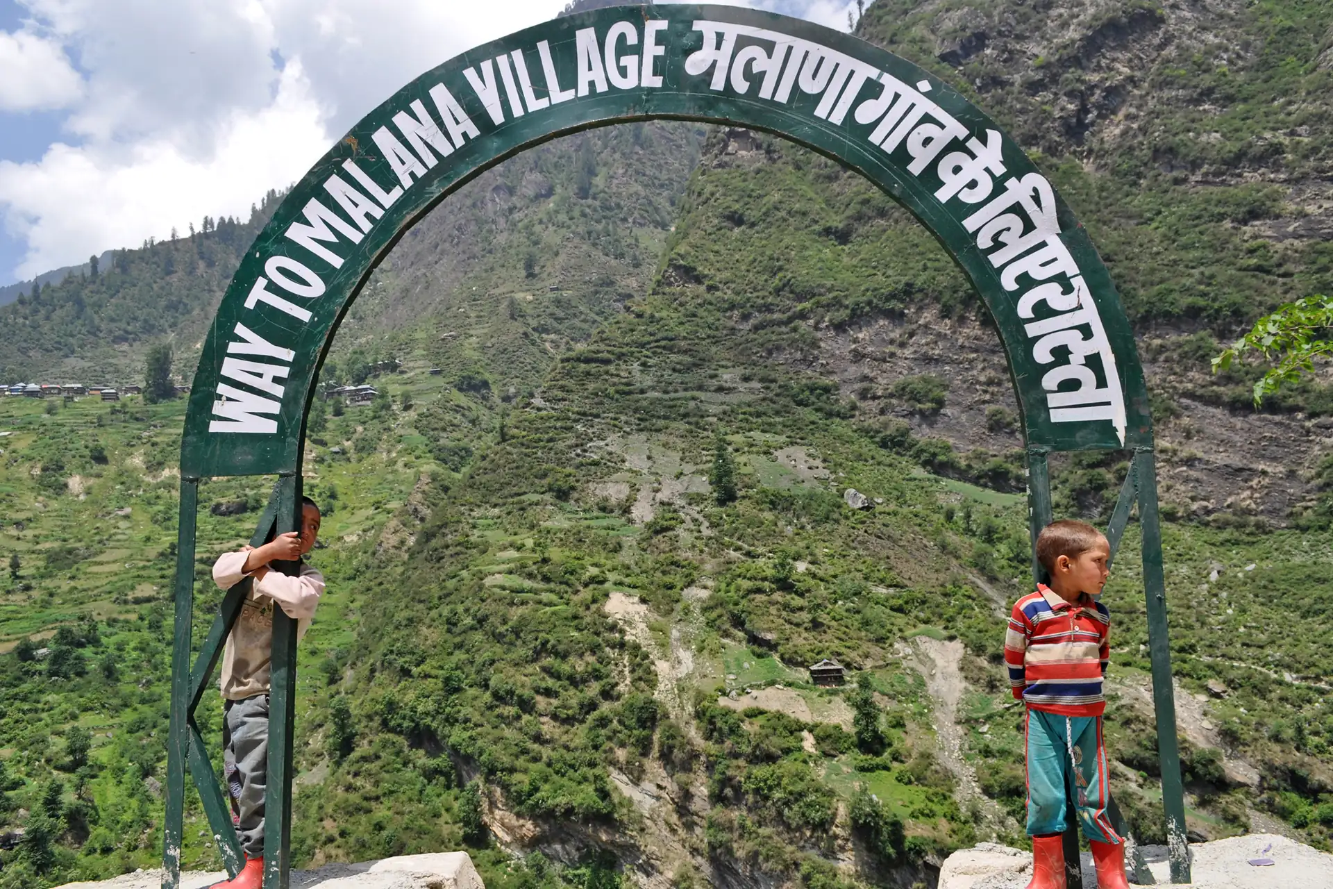 The welcome arch on the path into Malana