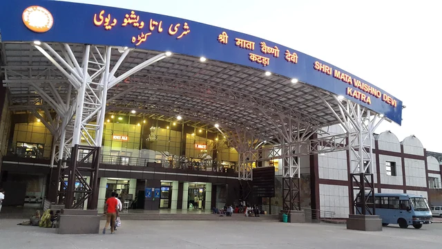The blue arched canopy and glass front of Shri Mata Vaishno Devi Katra railway station