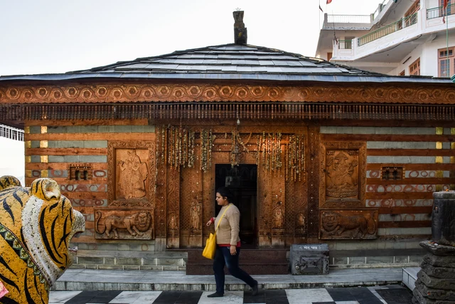 The carved wooden front of the temple at Bhekhli above Kullu