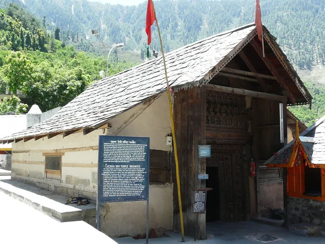 The Lakshana Devi Temple at Bharmour with a slate roof and a carved wooden doorway