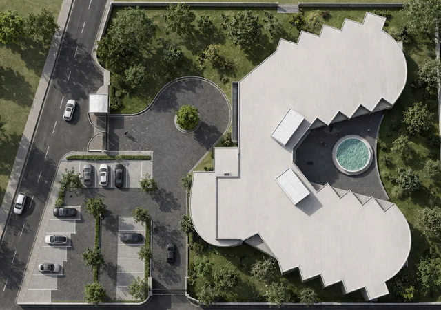 Tribe Den from above: two curved wings around a round court, parking beside
